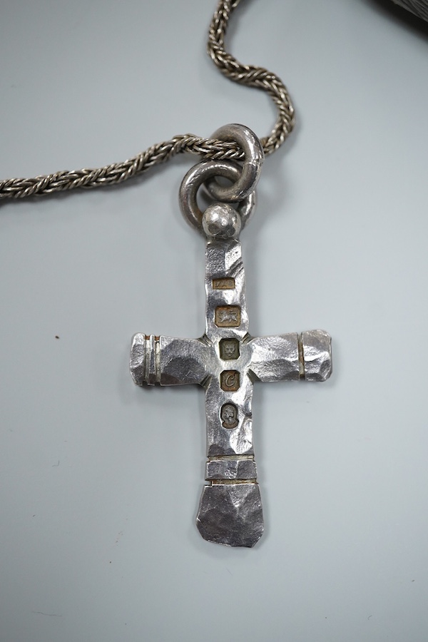 Michael Allen Bolton, a silver cross pendant and a pair of earrings, comprising: a cross pendant of textured design, length 5.1cm, British hallmarks for silver, sponsor's mark MAB, date letter for 1977, on a silver chain